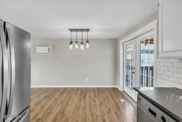 a kitchen with a stove a sink and a refrigerator