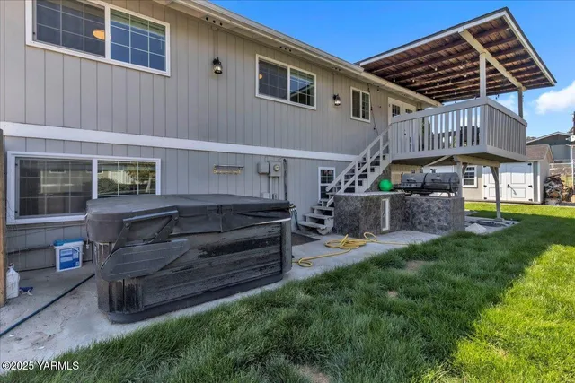 a view of a chairs and table in the balcony