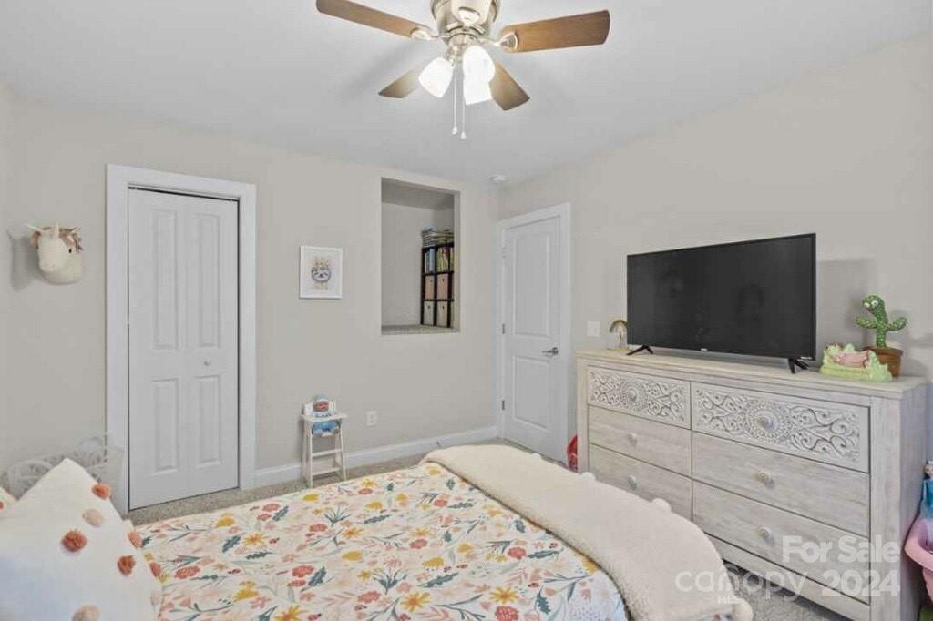 2522 Snow Creek Road Northeast Hickory, NC 28601 - Photo 15 of 24 a bedroom with a bed and a flat screen tv