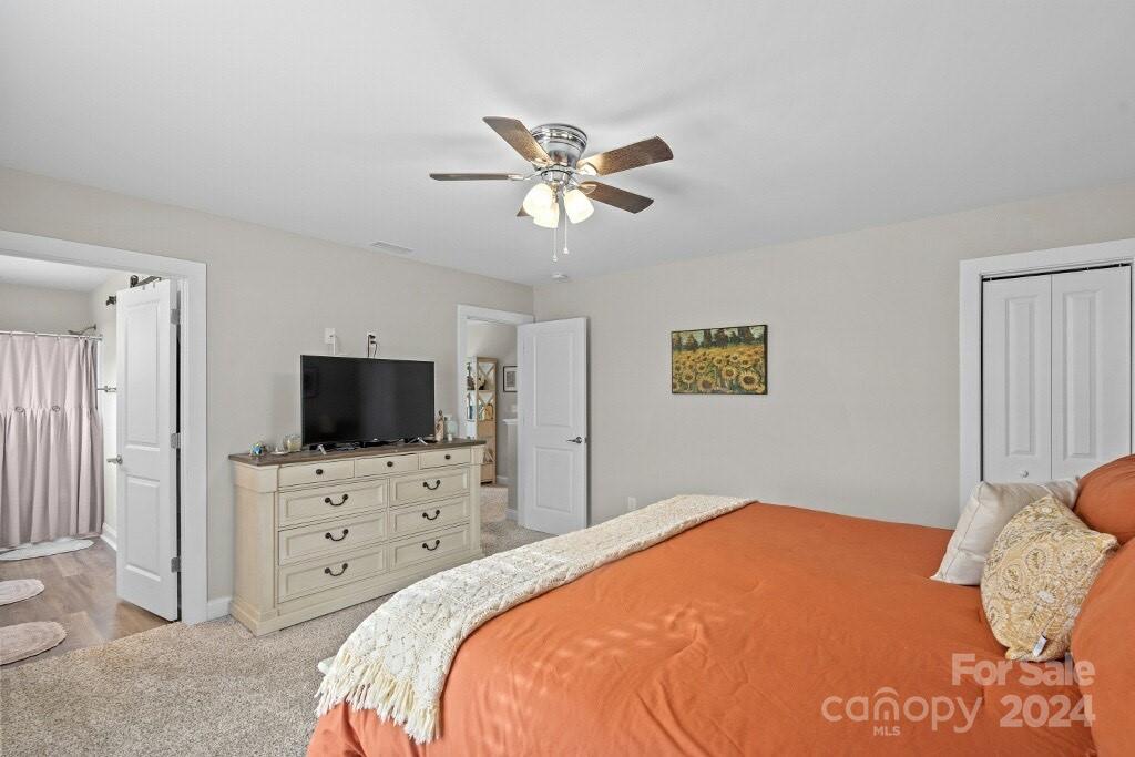 2522 Snow Creek Road Northeast Hickory, NC 28601 - Photo 19 of 24 a bedroom with a bed and a flat screen tv