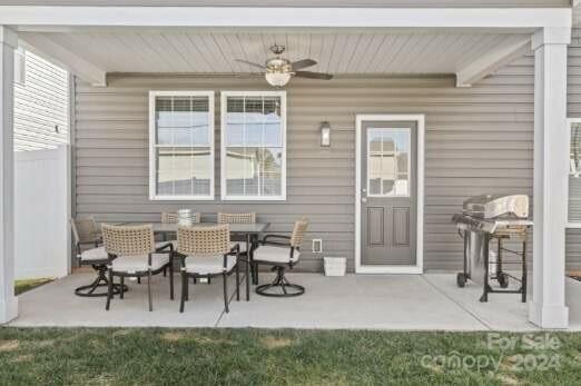 2522 Snow Creek Road Northeast Hickory, NC 28601 - Photo 24 of 24 a view of a patio with table and chairs and potted plants