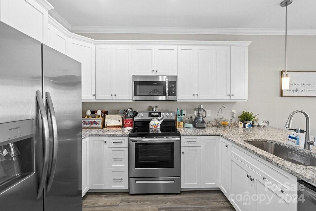 2522 Snow Creek Road Northeast Hickory, NC 28601 - Photo 4 of 24 a kitchen with stainless steel appliances granite countertop a refrigerator sink and white cabinets
