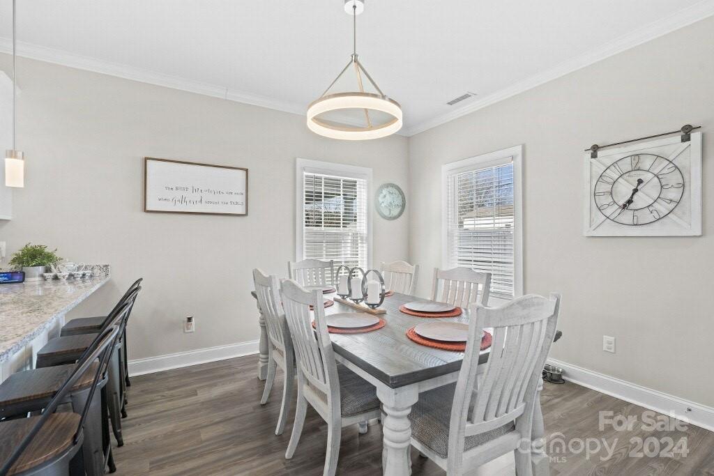2522 Snow Creek Road Northeast Hickory, NC 28601 - Photo 8 of 24 a view of a dining room with furniture window and wooden floor