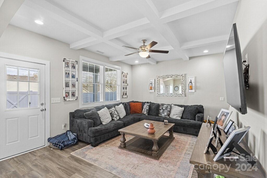 2522 Snow Creek Road Northeast Hickory, NC 28601 - Photo 10 of 24 a living room with furniture ceiling fan and a wooden floor