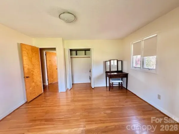 a view of a livingroom with furniture and wooden floor