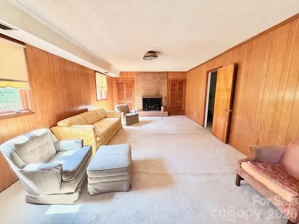 a large living room with furniture and a large window