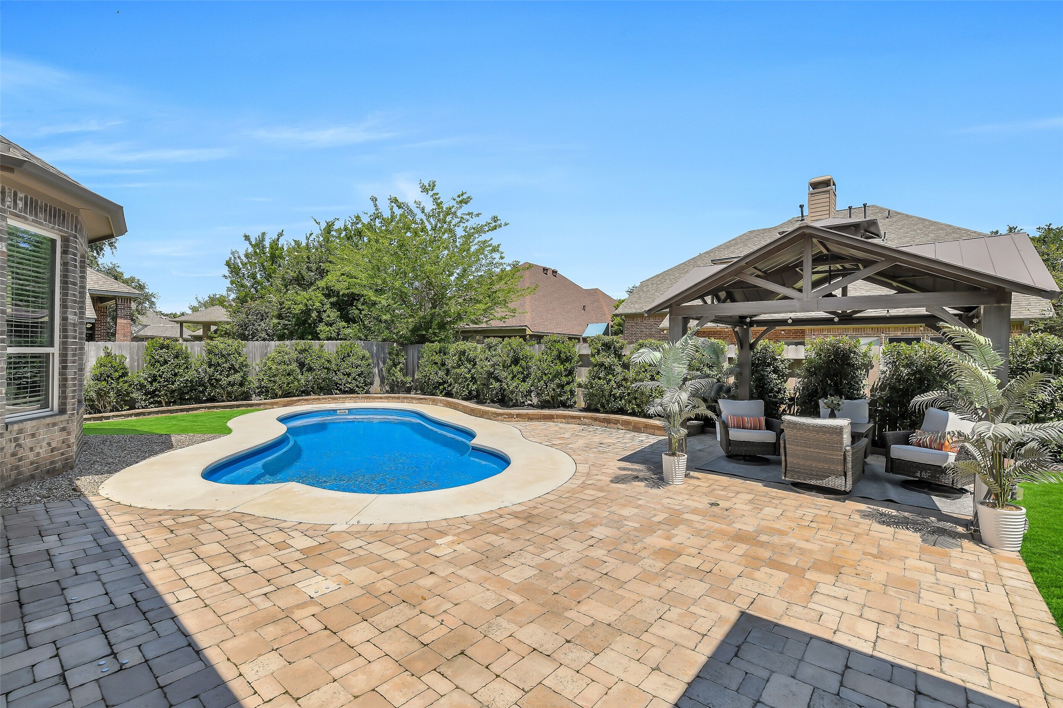 12207 Shorebridge Road Cypress, TX 77433 - Photo 37 of 41 a view of a swimming pool with a patio