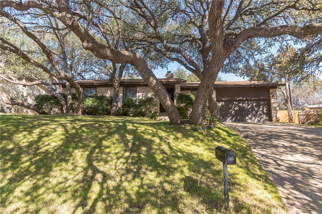 1410 Vista Ridge Cove Austin, TX 78754 - Photo 1 of 1 a front view of a house with a yard