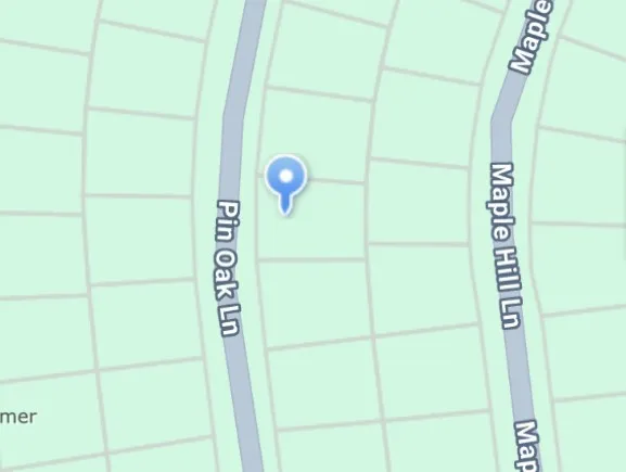 an aerial view of a house with yard