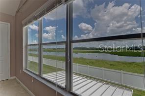 4744 Pond Ridge Drive Riverview, FL 33578 - Photo 4 of 18 a view of a balcony with floor to ceiling windows with wooden floor