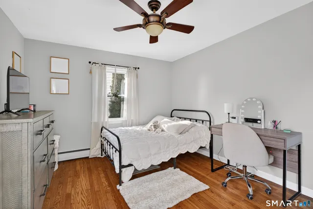 a bedroom with bed and a window