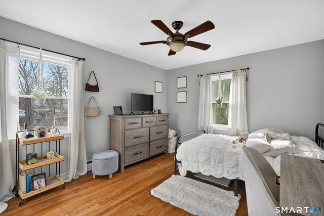 a bedroom with a bed furniture and a window