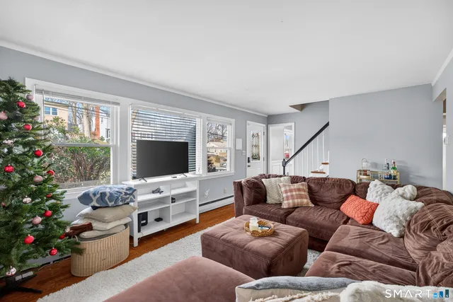 a living room with furniture fireplace and flowers