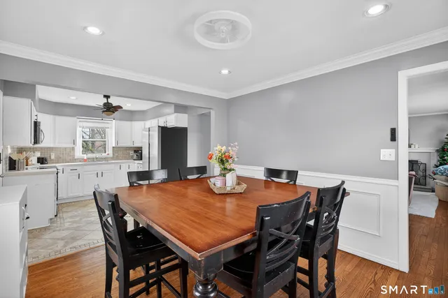 a view of a dining room with furniture and wooden floor