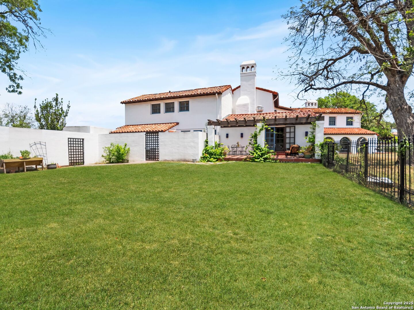 204 Zambrano Road San Antonio, TX 78209 - Photo 17 of 58 a view of a house with a big yard and large trees