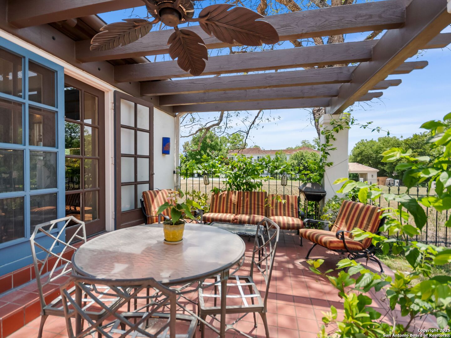 204 Zambrano Road San Antonio, TX 78209 - Photo 20 of 58 a view of an outdoor dining space with a table and chairs