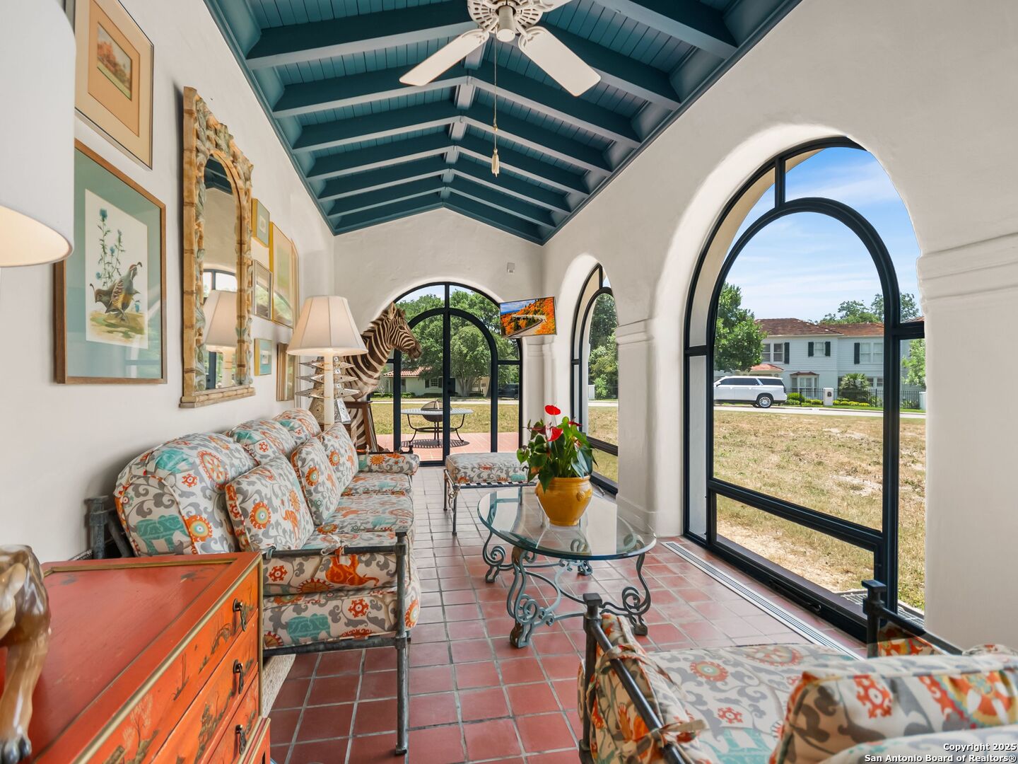 204 Zambrano Road San Antonio, TX 78209 - Photo 23 of 58 a living room with fireplace furniture and a floor to ceiling window