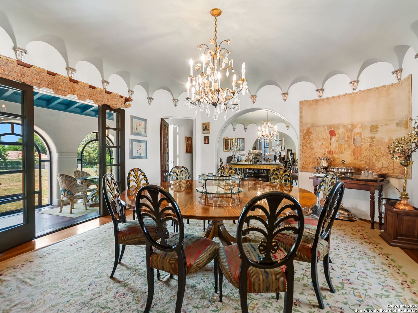 204 Zambrano Road San Antonio, TX 78209 - Photo 35 of 58 a dining room with furniture a chandelier and wooden floor
