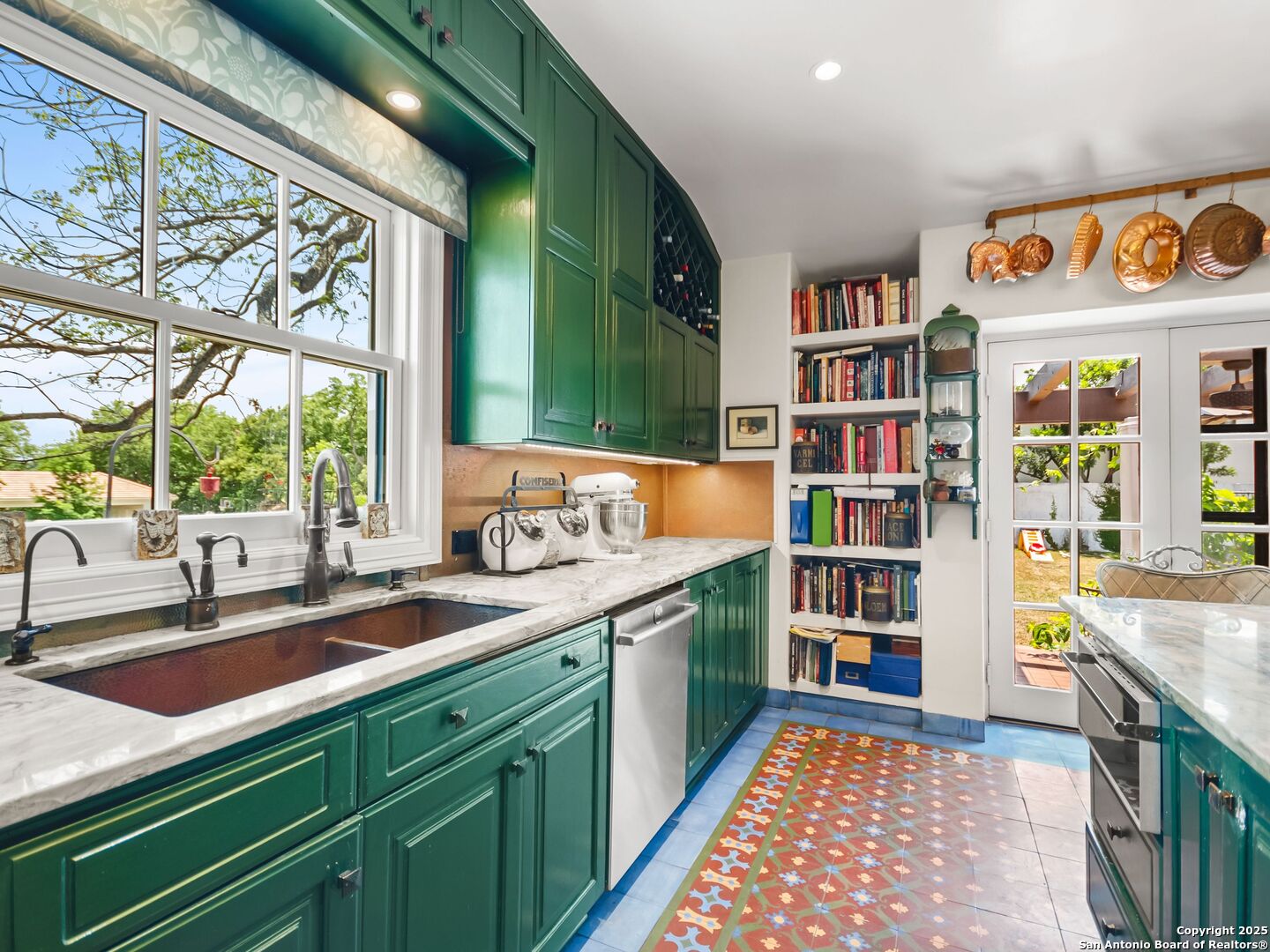 204 Zambrano Road San Antonio, TX 78209 - Photo 42 of 58 a kitchen with stainless steel appliances granite countertop a sink and a stove