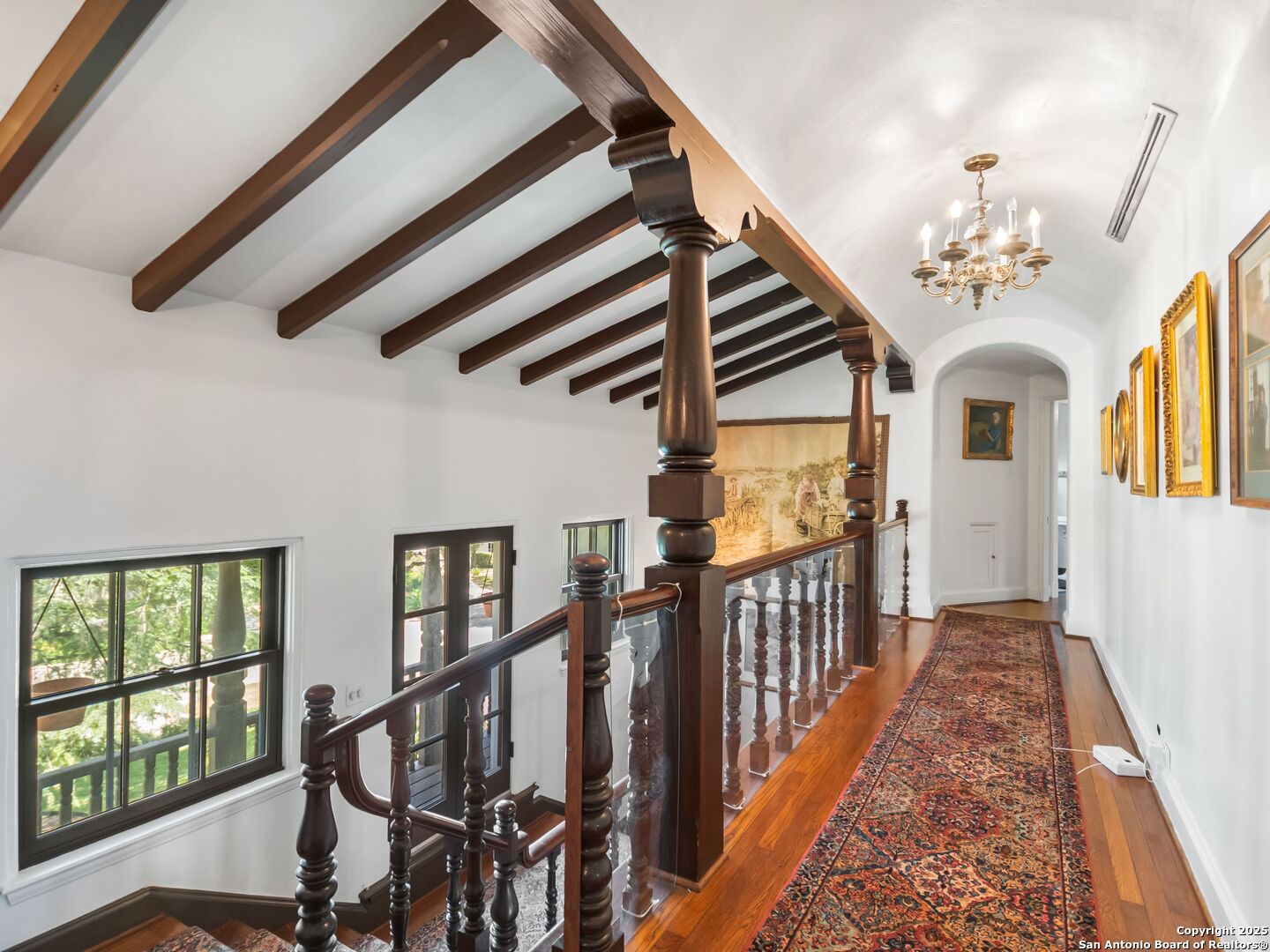 204 Zambrano Road San Antonio, TX 78209 - Photo 46 of 58 a view of a hallway with wooden floor and staircase