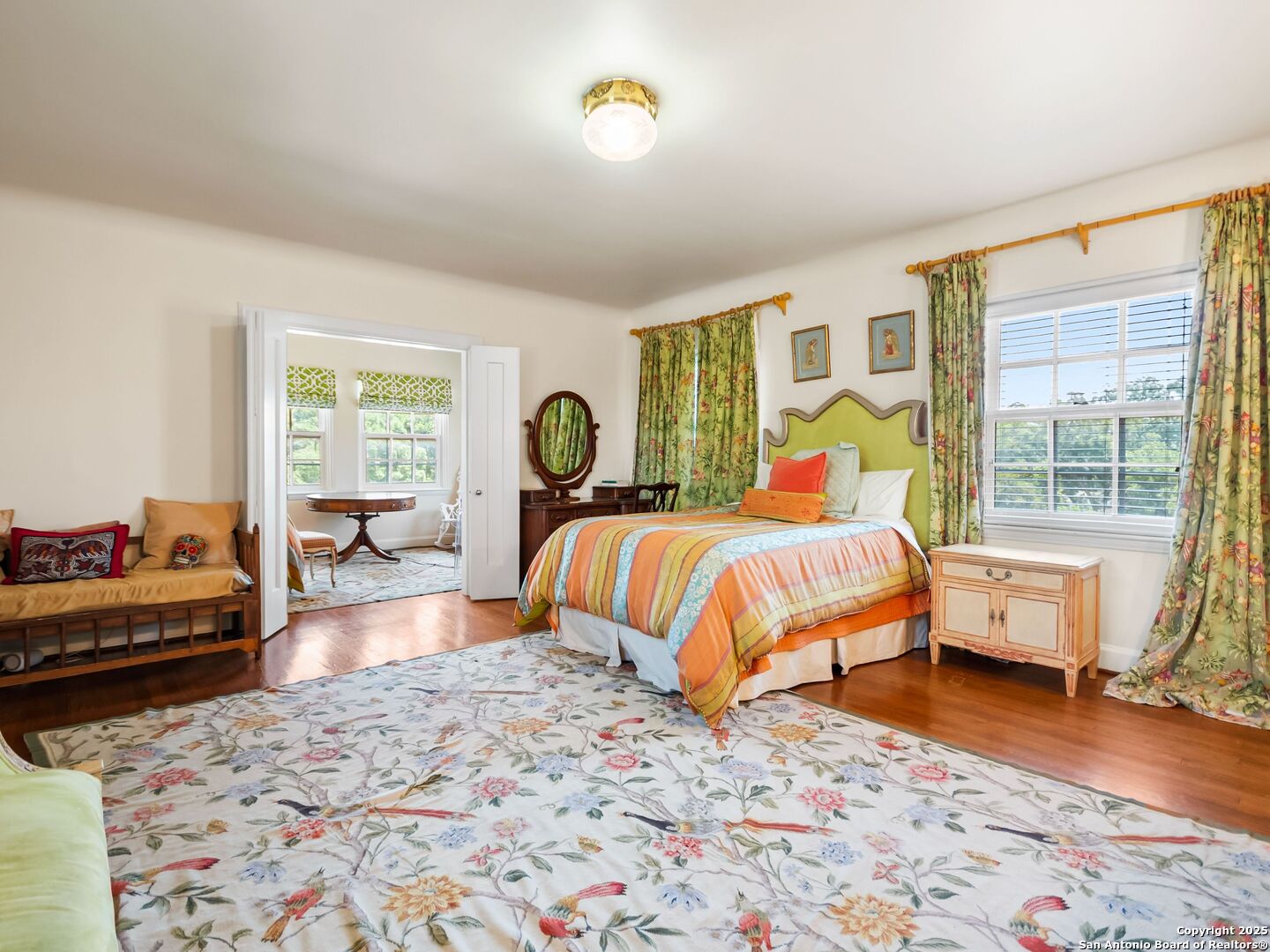 204 Zambrano Road San Antonio, TX 78209 - Photo 53 of 58 a bedroom with a bed and wooden floor