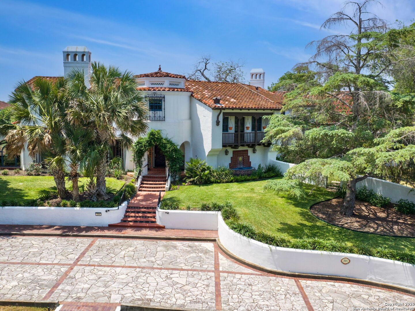 204 Zambrano Road San Antonio, TX 78209 - Photo 56 of 58 a front view of a house with a yard