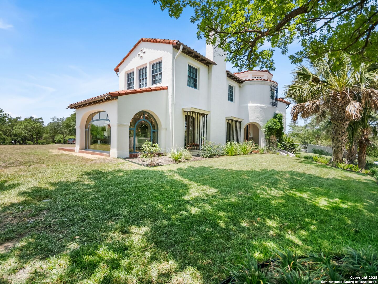 204 Zambrano Road San Antonio, TX 78209 - Photo 8 of 58 a front view of a house with a yard