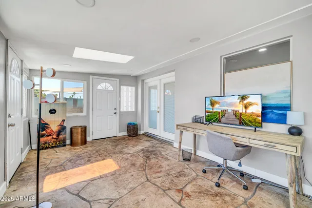 a workspace with furniture and window