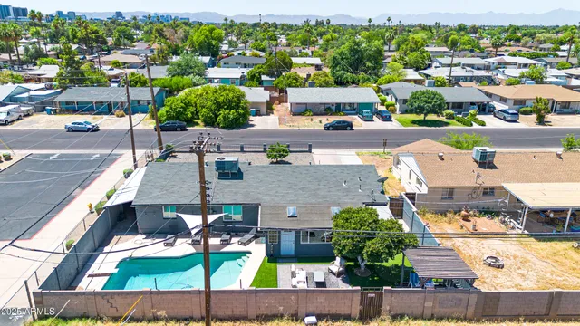 an aerial view of a house with a ocean view