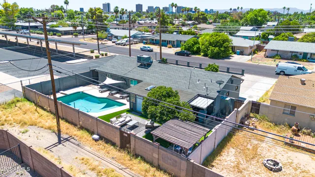 an aerial view of residential houses with outdoor space