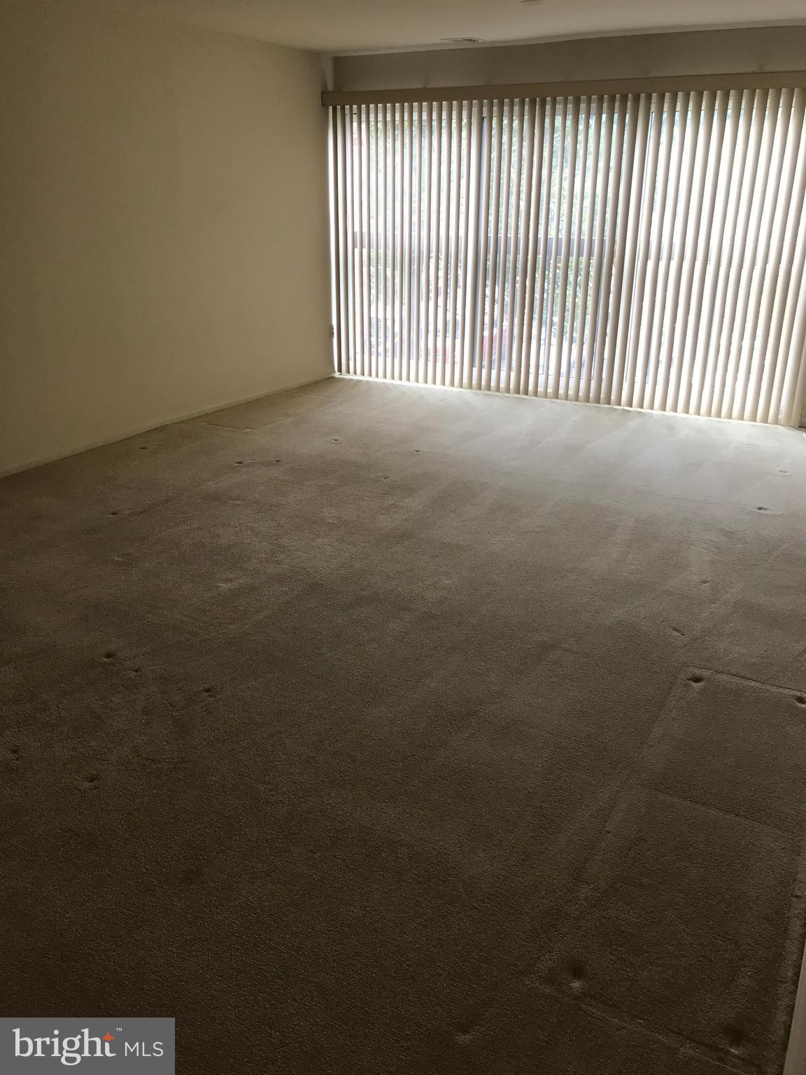 2817 Jermantown Road, Unit 203 Oakton, VA 22124 - Photo 12 of 22 a view of an empty room with a window