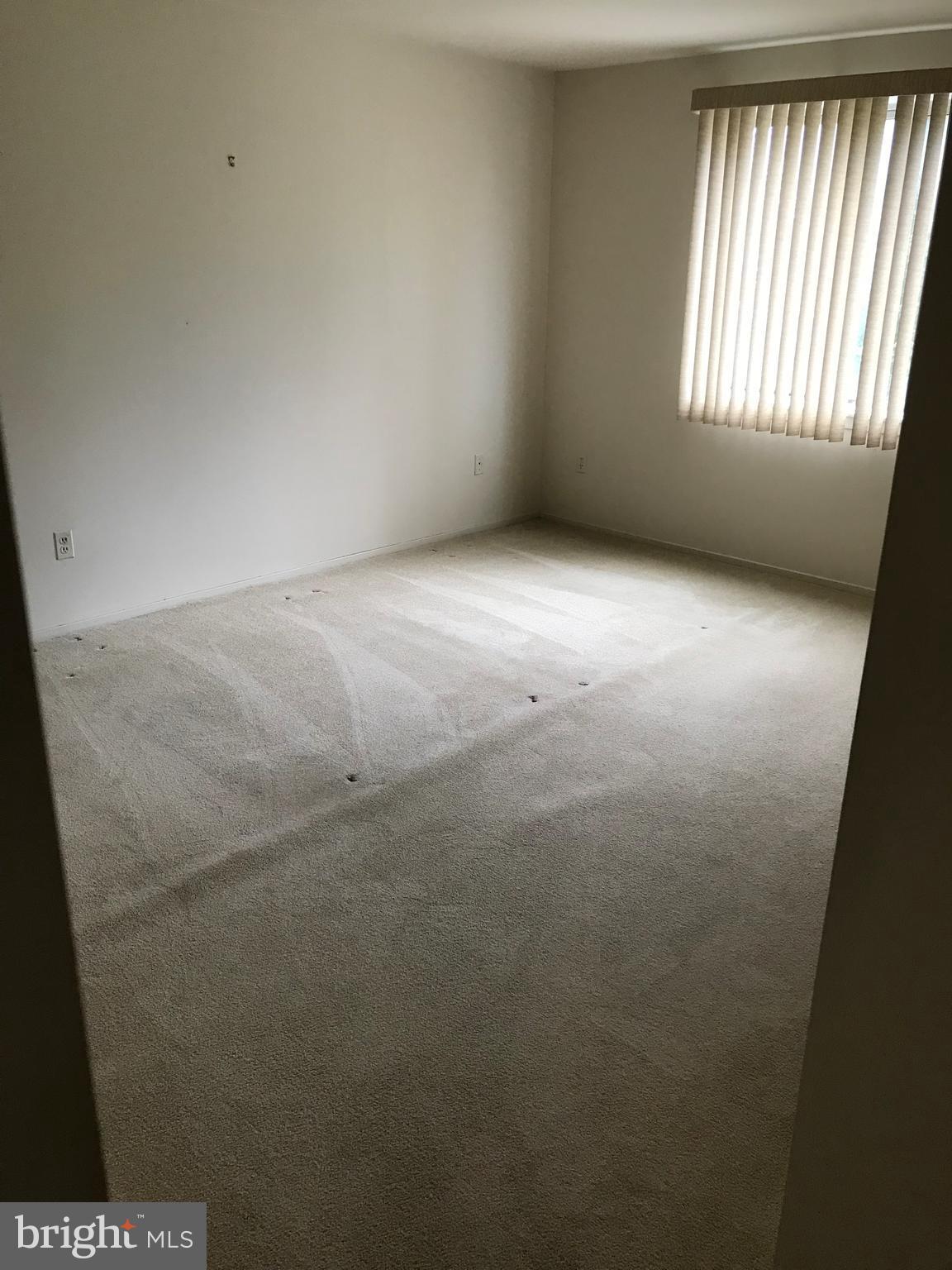 2817 Jermantown Road, Unit 203 Oakton, VA 22124 - Photo 16 of 22 a view of an empty room with a window