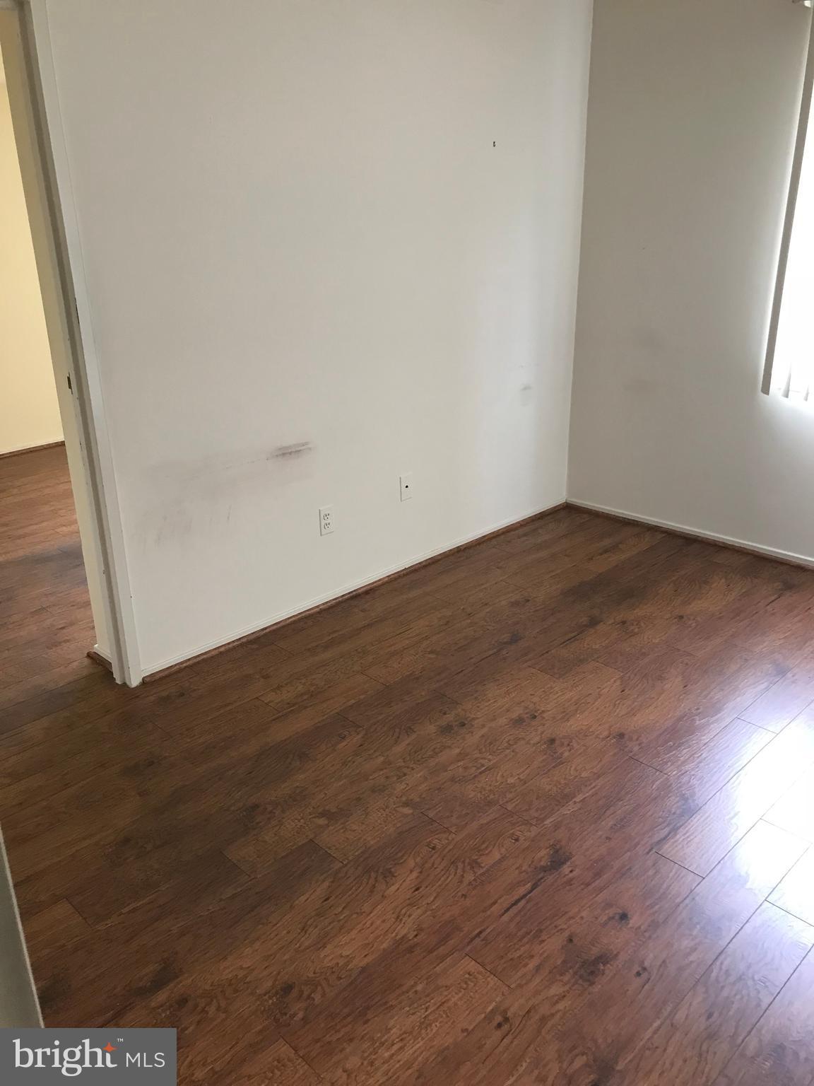 2817 Jermantown Road, Unit 203 Oakton, VA 22124 - Photo 9 of 22 a view of empty room with wooden floor