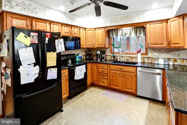 a dining table and chairs in a kitchen