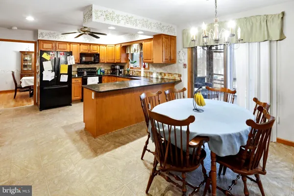 a view of a dining room with furniture and window
