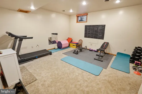 a view of an empty room with stairs