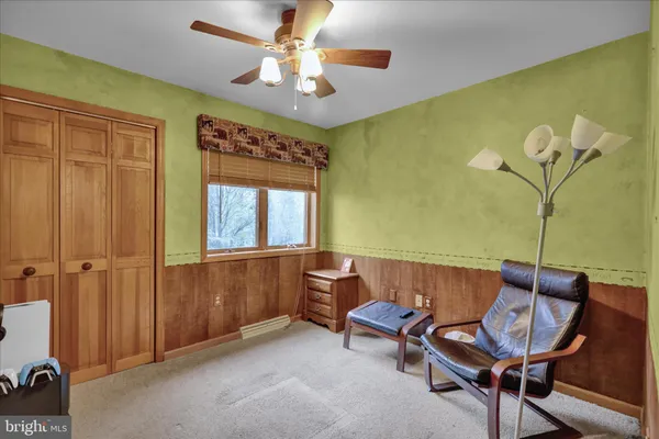 a bedroom with furniture and window