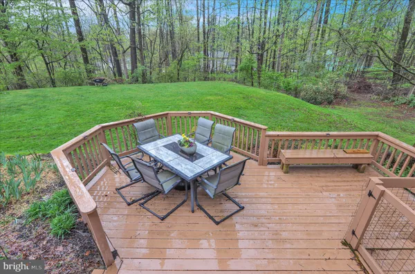 a view of sitting area with furniture and wooden floor