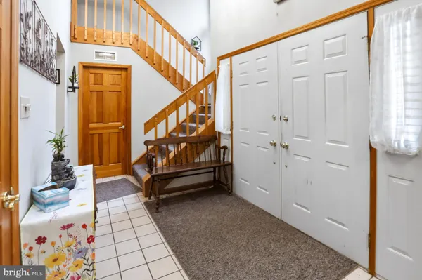 a view of entryway with wooden floor