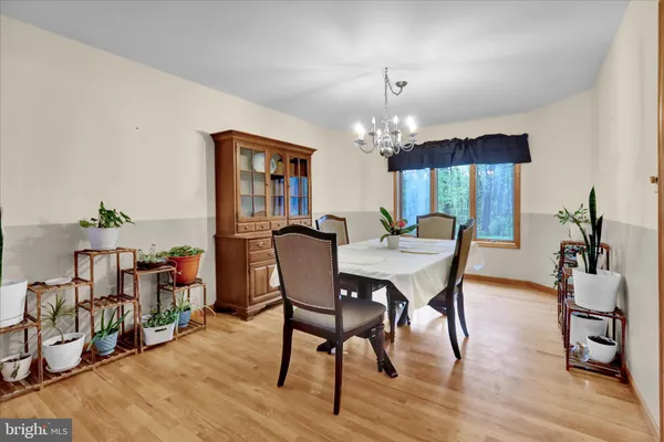 a kitchen with granite countertop stainless steel appliances cabinets a sink and a counter top space