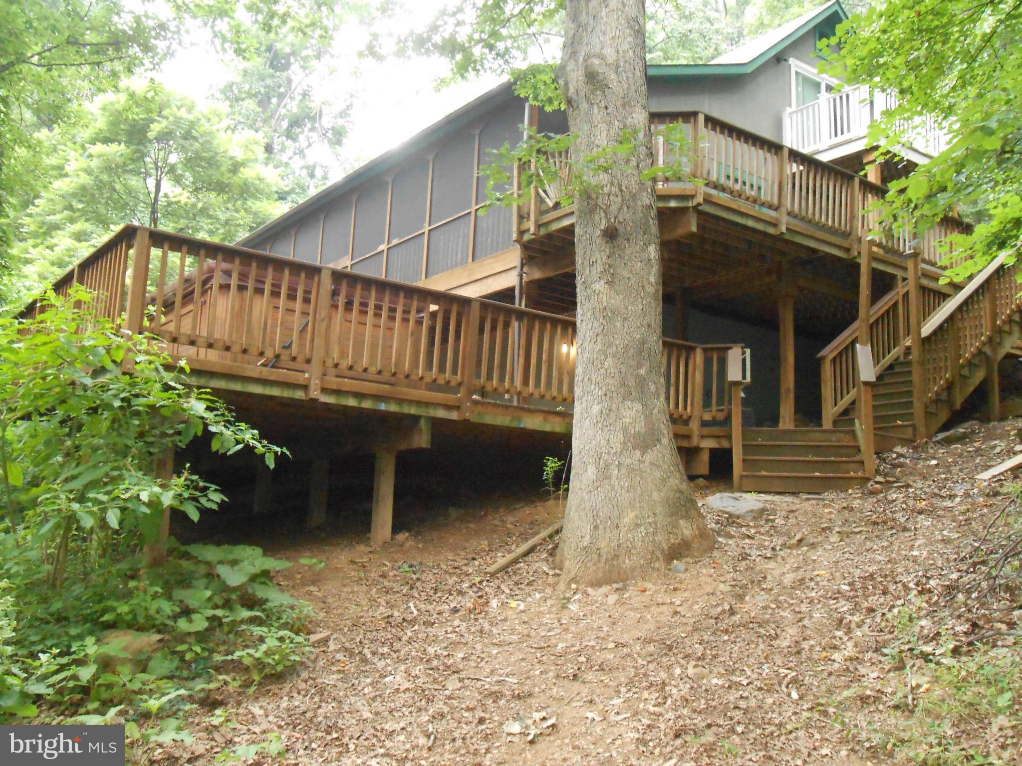 828 Jonathan Road Linden, VA 22642 - Photo 24 of 24 a view of house with backyard and deck