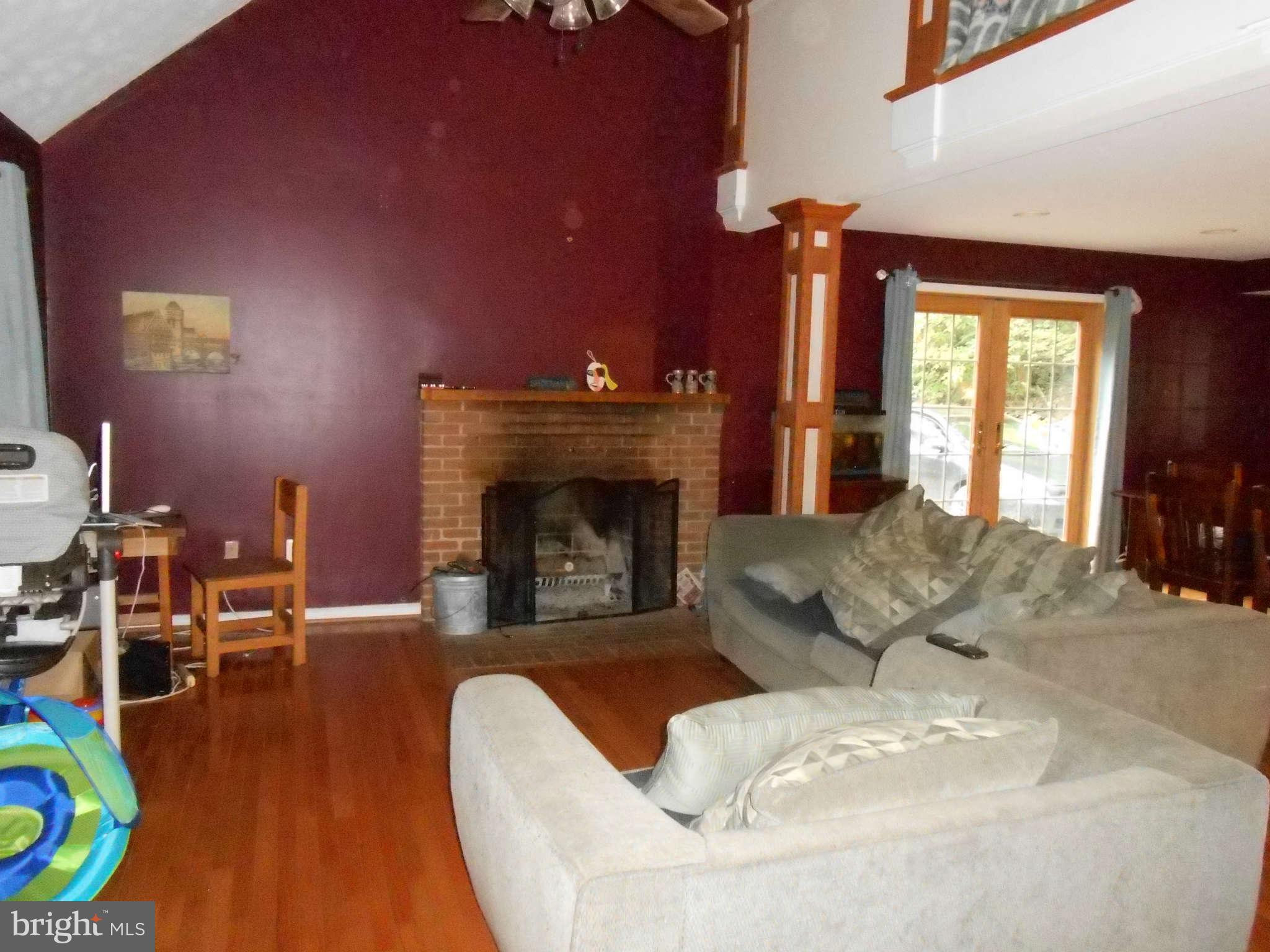 828 Jonathan Road Linden, VA 22642 - Photo 5 of 24 a living room with furniture and a fireplace