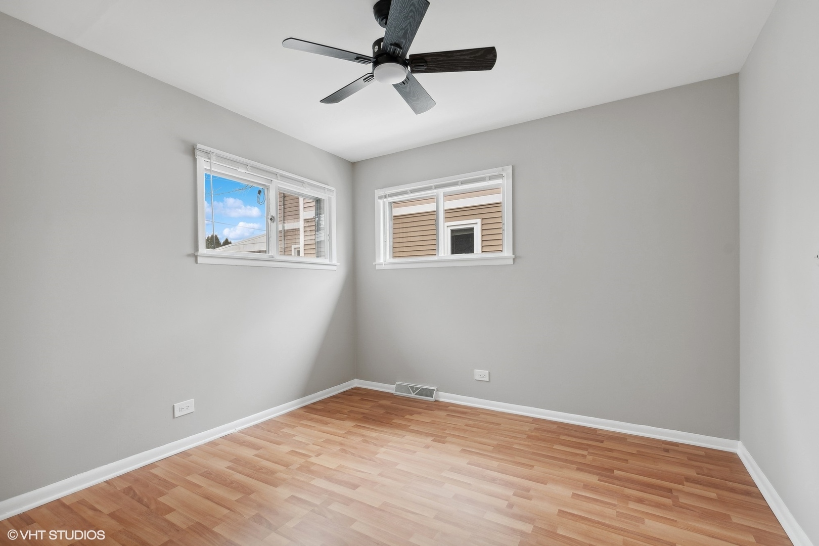 2490 Green Bay Road Highland Park, IL 60035 - Photo 13 of 29 a view of a big room with wooden floor and a ceiling fan