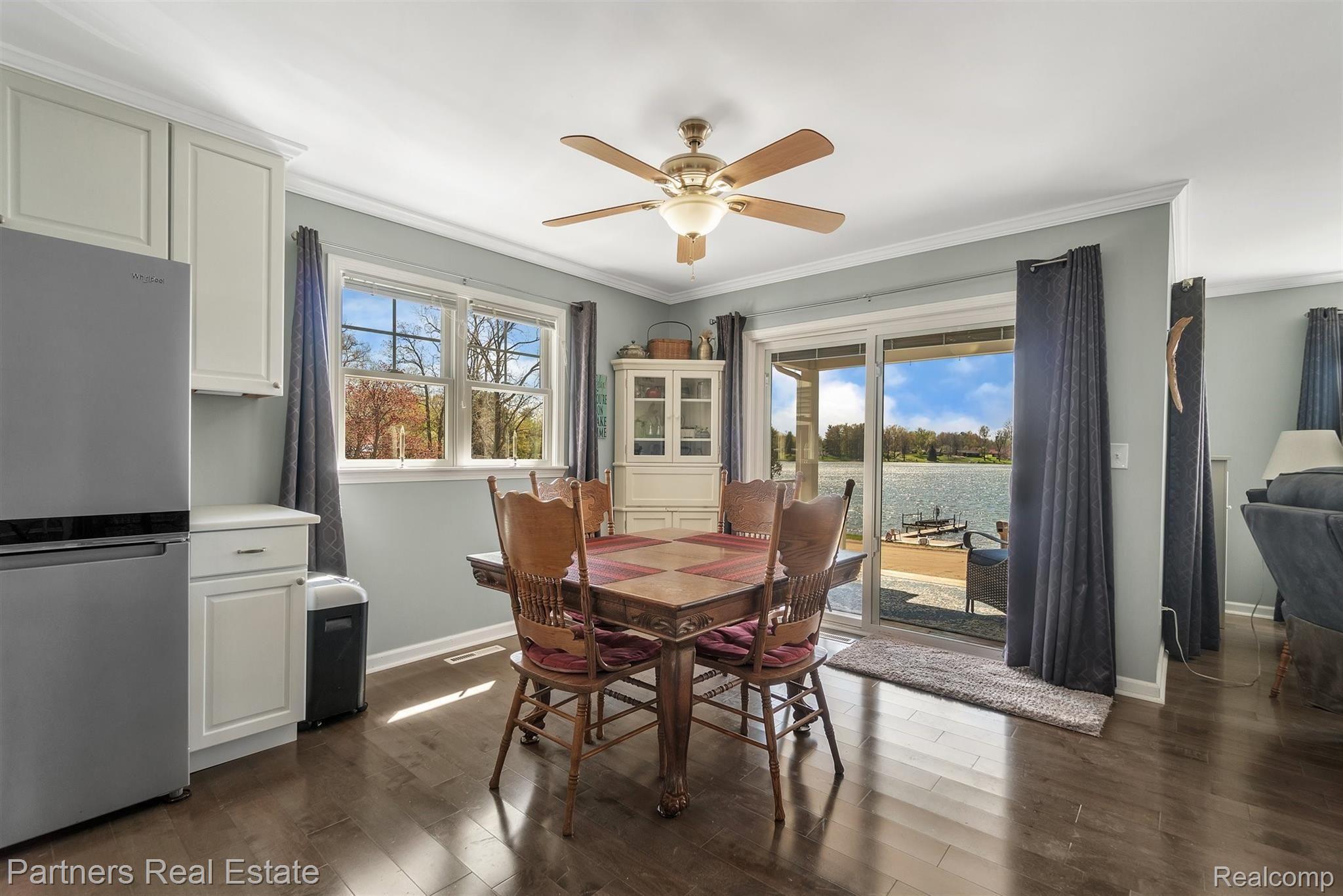 16051 Murray Road Byron, MI 48418 - Photo 13 of 41 You can't beat the view you get to enjoy with every meal! Sliding glass doors have built in shades!