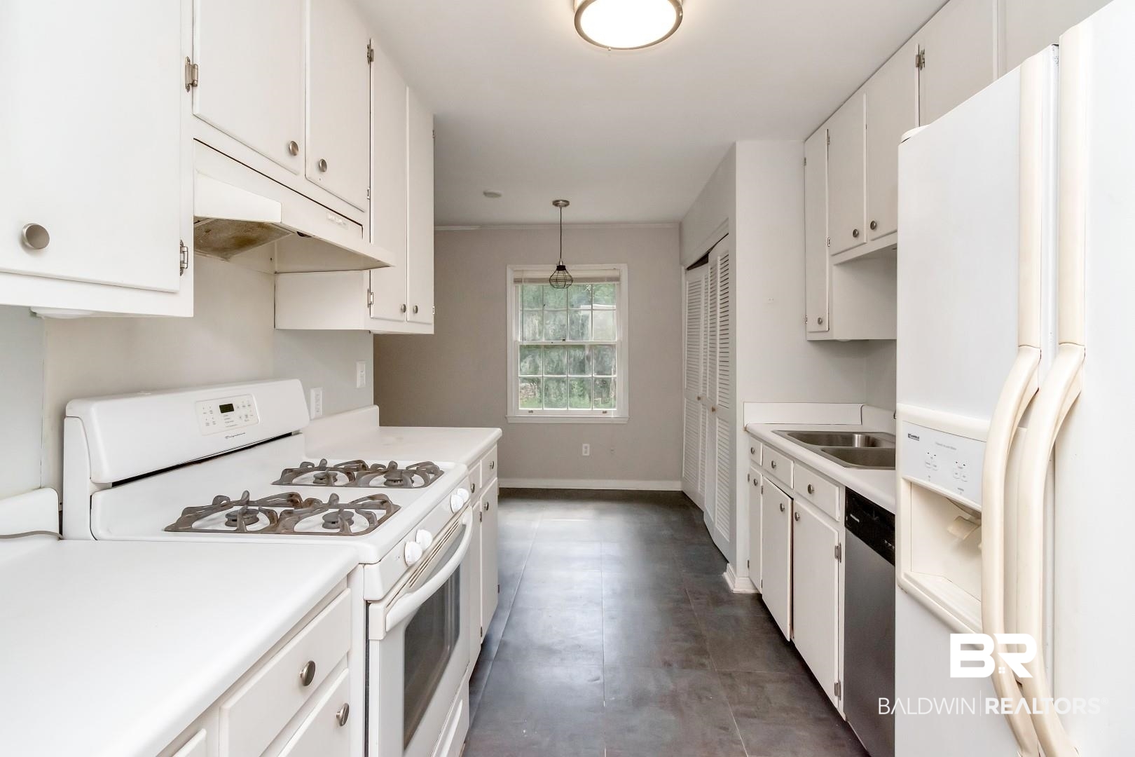 320 Vanderbilt Drive Mobile, AL 36608 - Photo 19 of 39 Kitchen featuring white cabinets, white appliances, decorative light fixtures, and sink