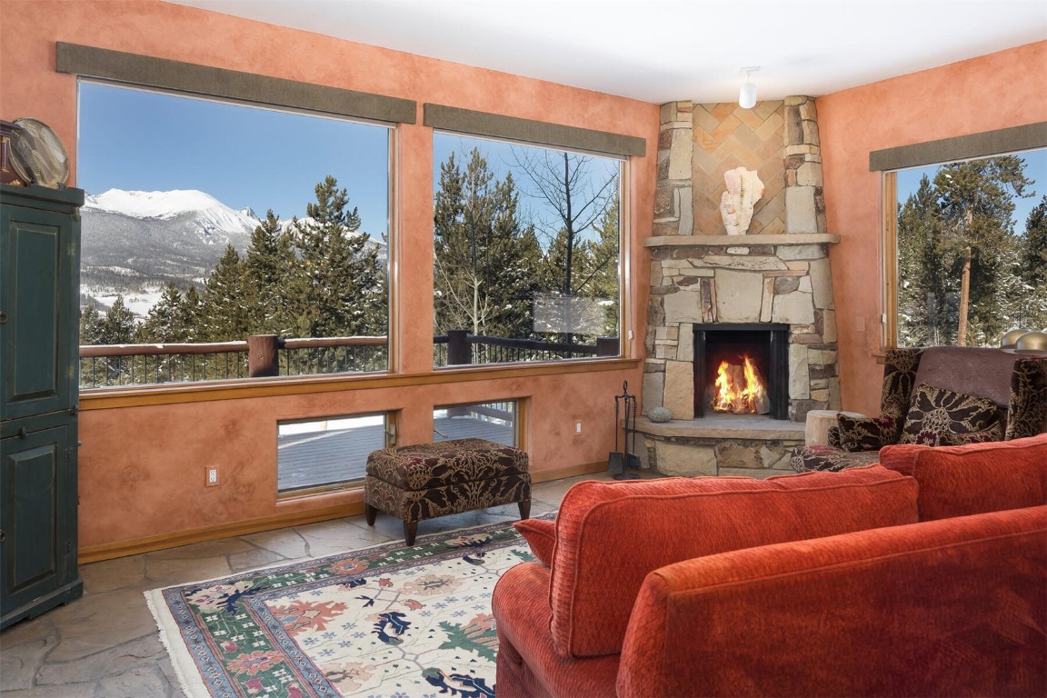 145 F Road Silverthorne, CO 80498 - Photo 3 of 35 a living room with furniture and a fireplace