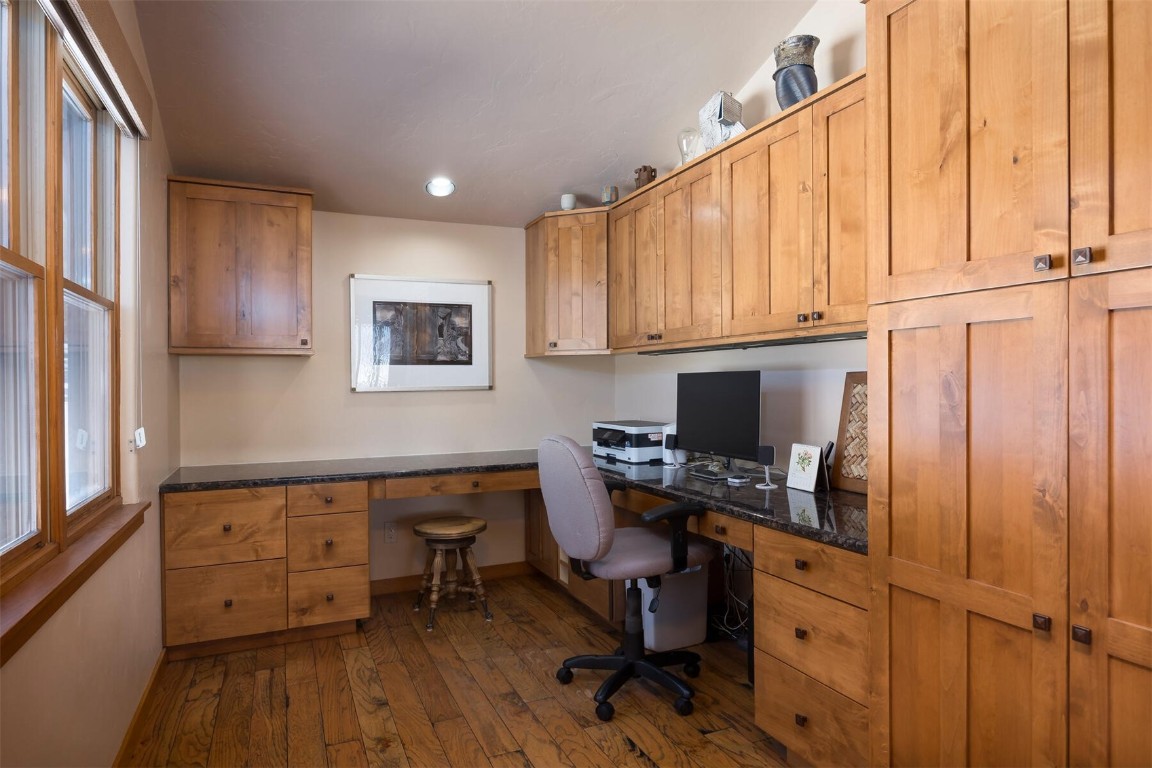 145 F Road Silverthorne, CO 80498 - Photo 8 of 35 a view of a workspace with furniture and wooden floor