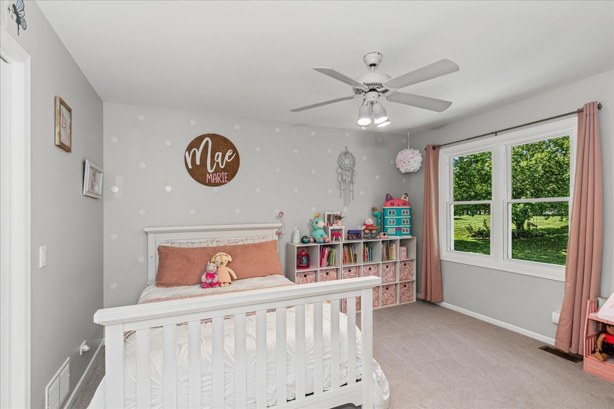 11111 Huron Drive Spring Grove, IL 60081 - Photo 11 of 20 a bedroom with furniture and a large window