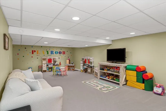 a room with furniture and a flat screen tv