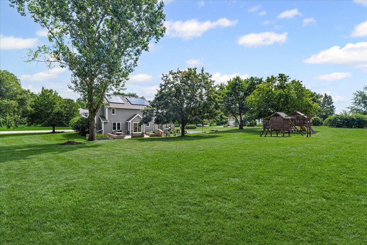 11111 Huron Drive Spring Grove, IL 60081 - Photo 17 of 20 a view of a house with a big yard and large trees